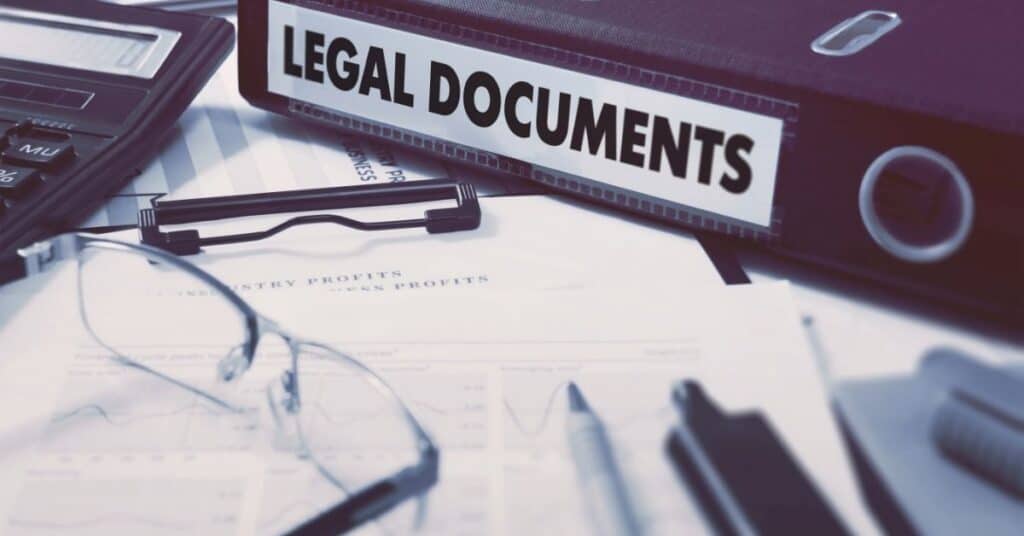 16 Best Legal Pages for Websites: Blog & Business Must-Haves - stack of legal papers and documents on table