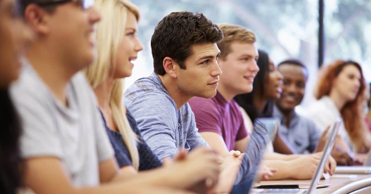 finance tips for college students - row of college students in a lecture hall